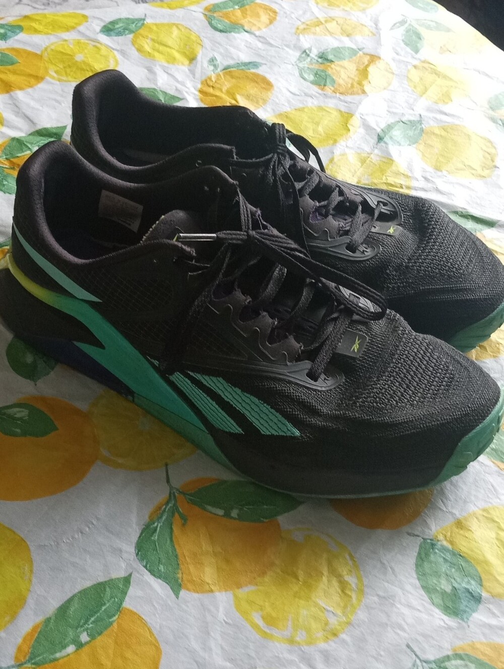 Reebok Black Sneakers with Teal Logo and Yellow Tab